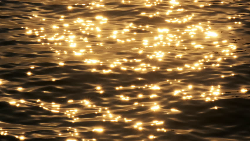 The sea's surface glittered with sparks.