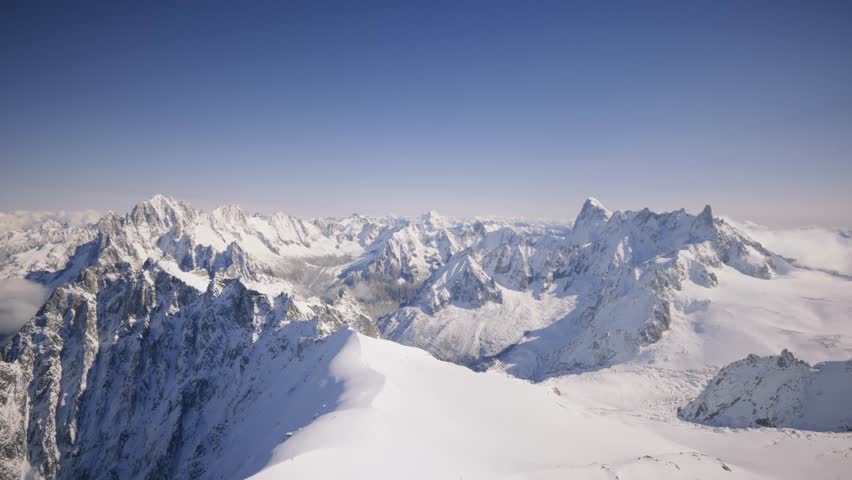 The Mont Blanc Massif is a vast mountain range in the Alps, featuring towering peaks, glaciers, and dramatic landscapes. Views from Aiguille du midi