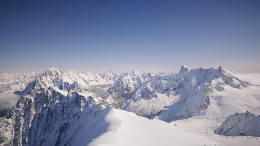 The Mont Blanc Massif is a vast mountain range in the Alps, featuring towering peaks, glaciers, and dramatic landscapes. Views from Aiguille du midi