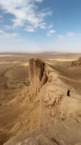 The edge of the world and red dunes of Saudi Arabia.
