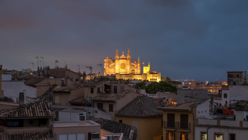 The Cathedral of Santa Maria of Palm, Palma de Mallorca, Mallorca, Balearic Islands, Spain. Day to night time lapse of the Historic Cathedral in Majorca. Zoom out