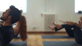 Athletes strengthen abdominal muscles during a yoga session, enhancing core stability and promoting overall fitness - Powered by Shutterstock - Get 15% off with code: PIKWIZARD15