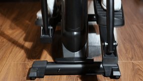 Close-up training cardio exercise on elliptical cross trainer in fitness - Powered by Shutterstock - Get 15% off with code: PIKWIZARD15