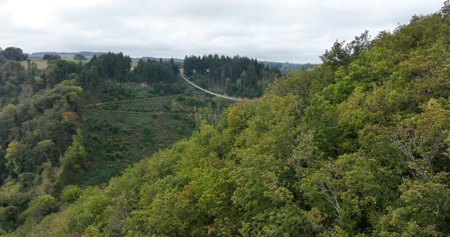 Aerial drone video of The Geierlay Suspension Bridge, pedestrians bridge, spans the Morsdorfer Bachtal. Adventure destination.