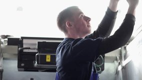 Auto mechanic adjustment automobile wheel alignment work at repair service station - Powered by Shutterstock - Get 15% off with code: PIKWIZARD15