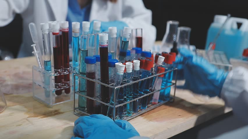 a scientist is working in a laboratory, a chemical researcher is preparing sample for a vaccine against a virus, work in lab concentrate is the most important because chemicals are dangerous - Powered by Shutterstock - Get 15% off with code: PIKWIZARD15