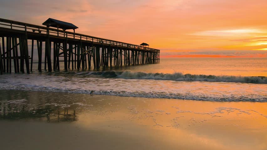 Sunrise and Wooden Pier on Fernandina Beach, Amelia Island, Florida, USA