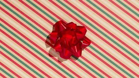 Unwrapping gift revealing a green screen - Stop Motion Animation - Red bow on craft Christmas background - Powered by Shutterstock - Get 15% off with code: PIKWIZARD15