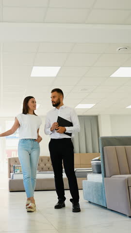 Furniture Store Consultant Assisting Customer with Selection
