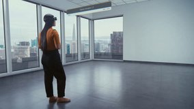 Asian female designer wearing virtual reality headset uses AI augmented reality interior design app to arrange office workspace or stylish apartment with 3D furniture and equipment. 3D visual effects. - Powered by Shutterstock - Get 15% off with code: PIKWIZARD15