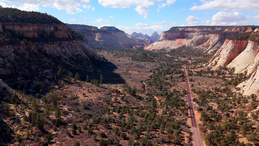 Breathtaking cinematic drone shot of Zion National Park captures the majestic rock formations and stunning natural beauty that make it a mustsee destination for nature lovers and explorers alike