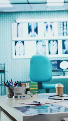 Vertical Video Empty doctor office featuring modern medical equipment and drugs, ready for the next patient consultation. Highlighting advanced diagnostics, healthcare services and patient care