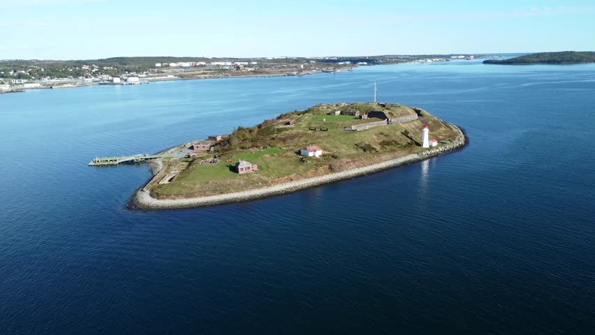 Cinematic Drone Shot of an Old Lighthouse on an Island in Halifax Bay, Canada. Lighthouse , Georges Island Lighthouse, Georges Island Road, Halifax, Nova Scotia