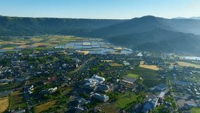 Aerial drone view of the spectacular landscape of Garden City lined with rice fields. - Powered by Shutterstock - Get 15% off with code: PIKWIZARD15