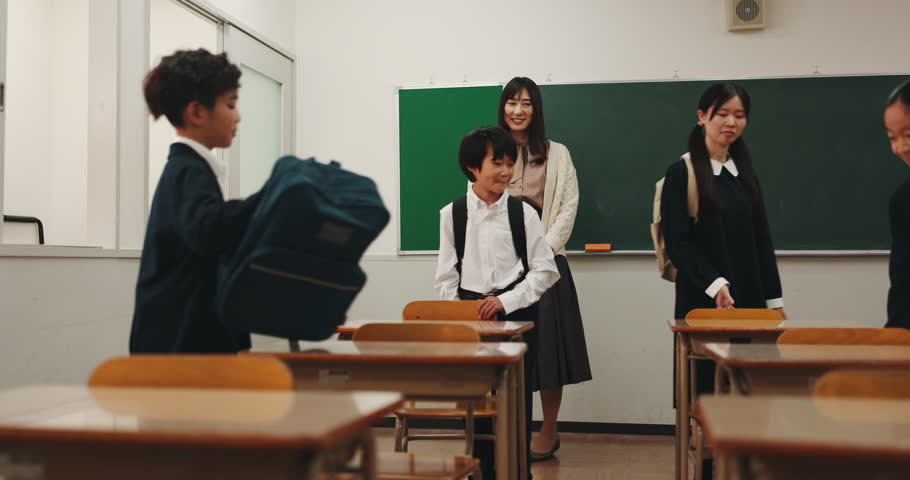 School, walking and Asian children in classroom in morning for studying, education and learning. Academy, campus and Japanese teacher with happy kids greeting for lesson, development and knowledge
