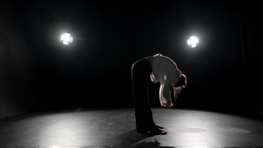 Inspiration by contemporary music, woman dancing modern choreography in studio. Attractive talented female dancer dancing alone on stage of theater, rehearsal room of school of arts, energy of motion