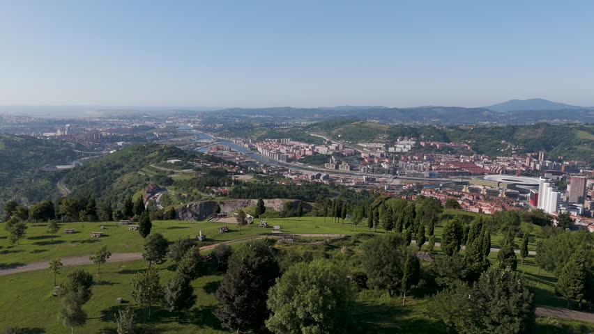 A drone footage of the green Mount Cobetas in Bilbao city on a sunny day in the province of Biscay, Spain