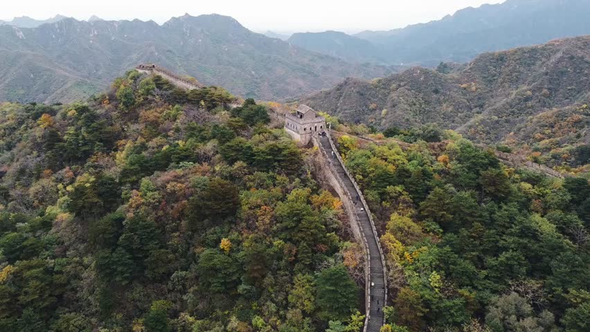 Aerial view of the Great Wall of China through the mountains in Huairou, near Beijing on a cloudy day of autumn