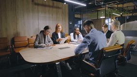 A diverse group of professionals meets around a large conference table to share innovative ideas, discuss strategies, and plan future projects for success and collaboration - Powered by Shutterstock - Get 15% off with code: PIKWIZARD15