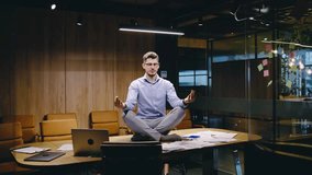 The image shows a meditative businessman balancing work in a serene office that promotes productivity through mindfulness, creating a space for emotional wellbeing and professional growth - Powered by Shutterstock - Get 15% off with code: PIKWIZARD15