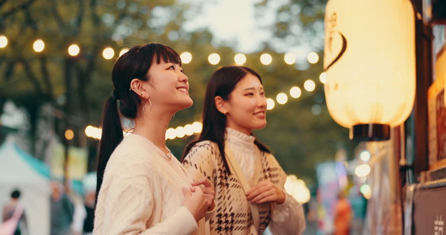 Festival, map and Japanese people at market for culture celebration, tourism event and spring season. Street vendor, hanami holiday and traditional with Asian friends and notice board for location