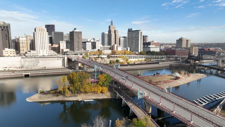 Aerial footage of downtown St. Paul, Minnesota, featuring the city skyline, bridges, and fall scenery along the Mississippi River