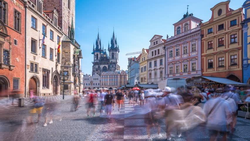 Prague Astronomical Clock and Church Cathedral main sqaure  timelapse hyperlapse, medieval astronomical clock, on the southern wall of Old Town City Hall in the Old Town Square, Prague, Czech Republic