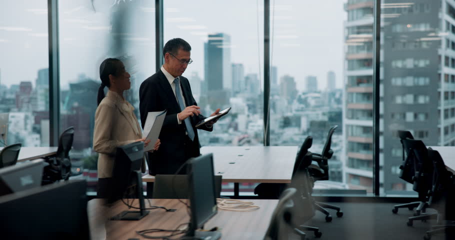 Man, woman and tablet with documents in office, talking and review for project at insurance agency. Japanese business people, secretary and boss with touchscreen, paperwork and feedback at company