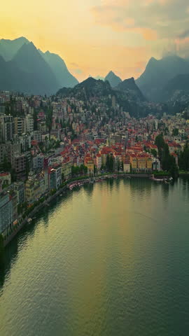 Aerial view of Lugano city and lugano lake from San Salvatore mountain. Aerial footage of the Monte Bre overlooking the city of Lugano in Canton Ticino in Switzerland