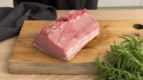 cook housekeeper place piece of pork chop on wooden board in kitchen. process of making homemade meal, cooking at home, food closeup, cooking pork roast - Powered by Shutterstock - Get 15% off with code: PIKWIZARD15