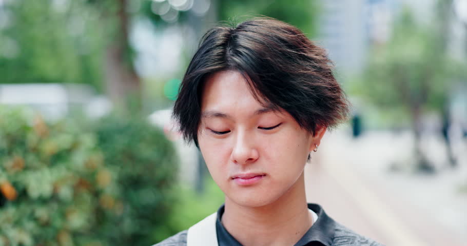 Japanese man, eating and rice ball for food, travel and traditional snack with holiday, explore and trip. Asian person, hungry and onigiri outdoor for local meal, vacation and breakfast on weekend