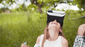 Young woman wearing vr glasses, headset, playing virtual games and watching videos outdoors. Emotions, scared. Close up. Concept of innovation technology, family entertainment, game - Powered by Shutterstock - Get 15% off with code: PIKWIZARD15