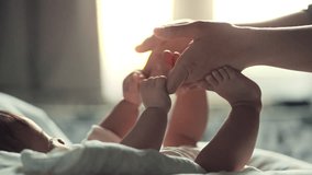 Little hand of child baby girl holding hand of mother, A newborn holds on to mom's, dad's finger, Love and relationship with infant, Care and support, Dreaming and protection - Powered by Shutterstock - Get 15% off with code: PIKWIZARD15