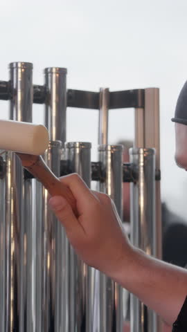 A talented percussion artist performing with a variety of unique and captivating metal instruments. Clip