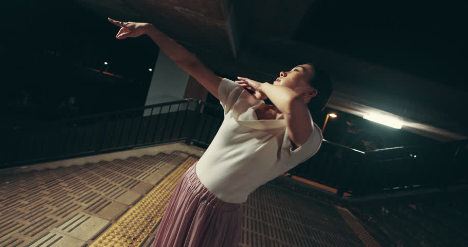 Asian woman, night and dancer with motion for street performance, kpop or choreography style in Japan. Japanese, female person or ballerina with fashion for ballet, fast dancing or time lapse in city