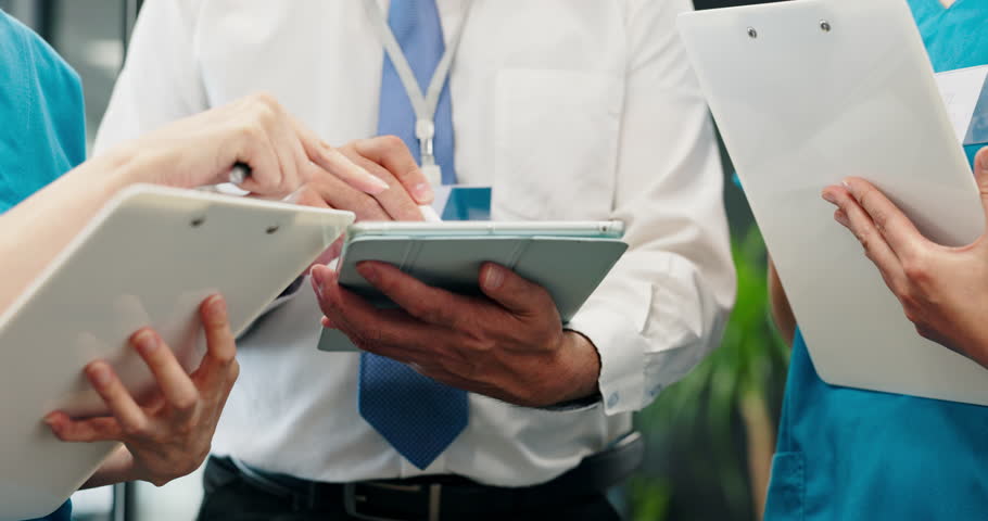 Doctor, hands and nurse with tablet for internship, coaching or training staff at hospital. Japanese, closeup or medical team with technology for healthcare development, research or collaboration