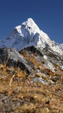 Mount Ama Dablam, Nepal. Snowy peak in Himalaya. Trek to the Everest Base Camp. Steadicam vertical shot