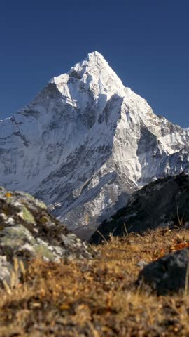 Mount Ama Dablam, Nepal. Snowy peak in Himalaya. Trek to the Everest Base Camp. Steadicam vertical shot