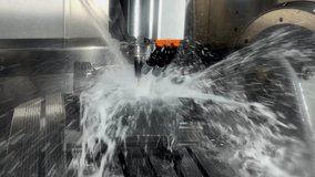 CNC milling machine cutting the mold parts with oil coolant method  The mold and die manufacturing process by machining center with the solid ball endmill tools. - Powered by Shutterstock - Get 15% off with code: PIKWIZARD15