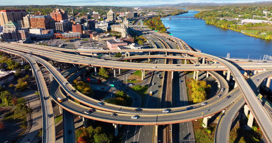 Aerial view of twisting highway in downtown Albany New York. Multi-level highway interchange with bridges and overpasses.