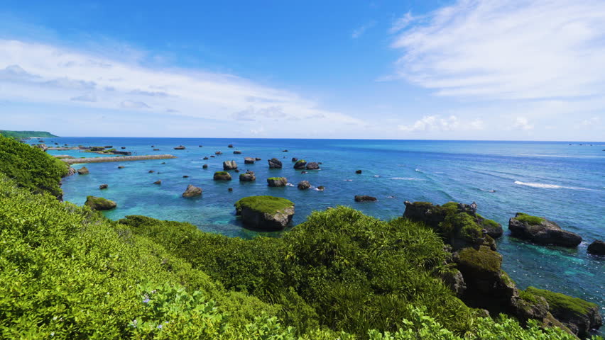 Cinematic shot of coral reef coastline at Hennasaki Lighthouse in Miyakojima Island, Okinawa, Japan