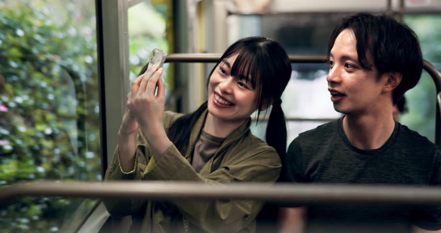 Phone, photography and cable car with Japanese couple and mt takao for social media post, travel blog and picture. Explore, bonding and transportation with asian man and woman in tram for adventure