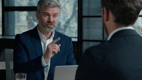 Serious Caucasian man consultant businessman consulting client business job interview in office employer hr manager communicate with male employee candidate men businessmen discuss project at meeting - Powered by Shutterstock - Get 15% off with code: PIKWIZARD15