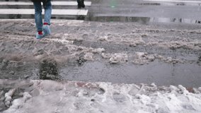 slush on the road in a snowfall in the city, mud and melting snow on a busy street. transport and cars drive on dirty asphalt melting snow - Powered by Shutterstock - Get 15% off with code: PIKWIZARD15