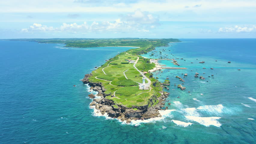 Cinematic aerial flyover of Hennasaki Lighthouse in Miyakojima Island in Okinawa, Japan