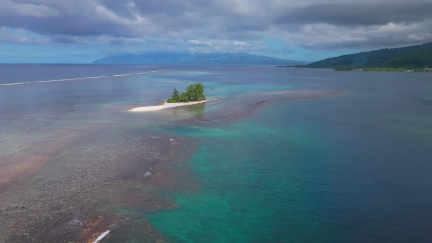 Lone island lost at sea Papeete Tahiti Tapahi Moto Au Mahina Orafara Ahonu French Polynesia aerial drone aqua turquoise clear water barrier coral reef white sand palm trees swim snorkel sail upwards