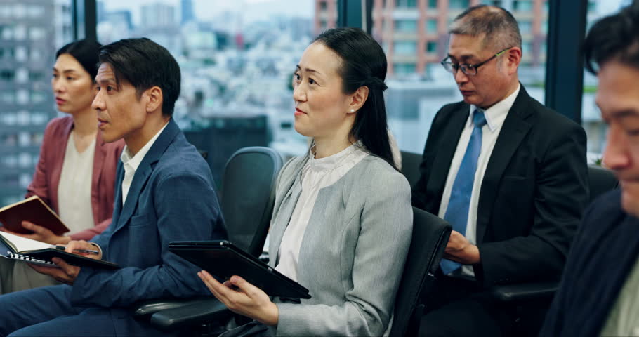 Asian people, meeting and seminar with team listening for presentation, conference or staff training at office. Japanese, group or employees with speaker for company vision or growth at convention