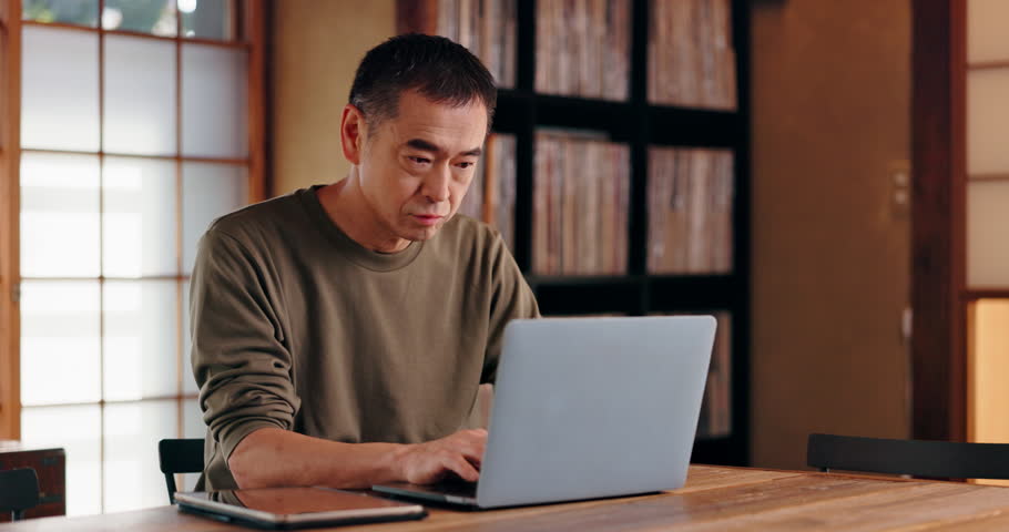 Japanese, mature man and freelancer with laptop for online article, editing and research information. Remote work, editor and typing with digital for solution, blog review and copywriting in house