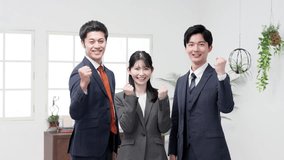 Asian business person doing a fist pump - Powered by Shutterstock - Get 15% off with code: PIKWIZARD15