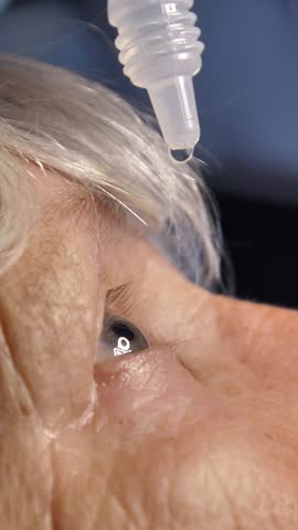 Old lady puts drops in her eyes. Effective medicines for adults, eye drops and vision problems